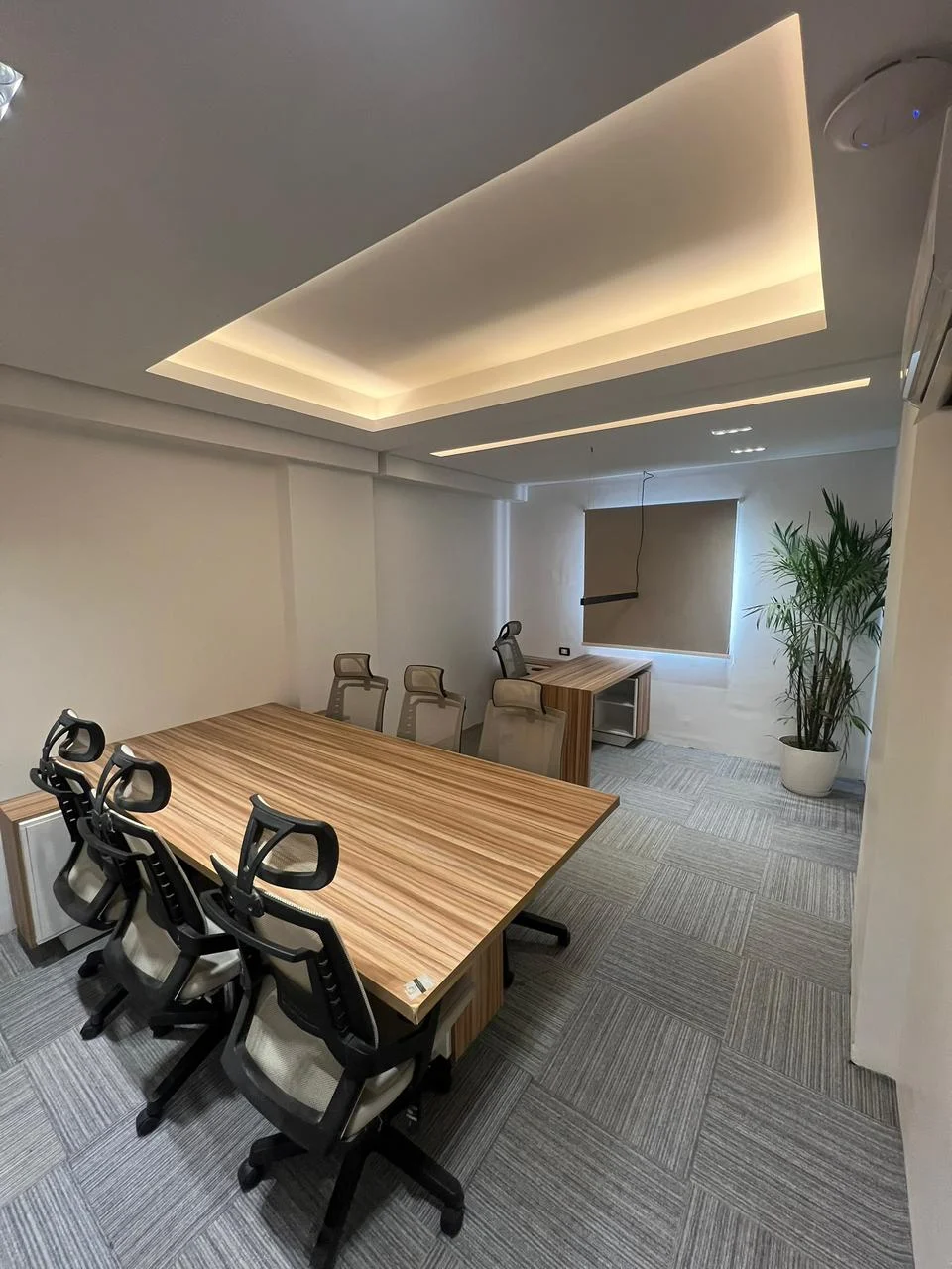 Modern workspace interior with desks and office chairs
